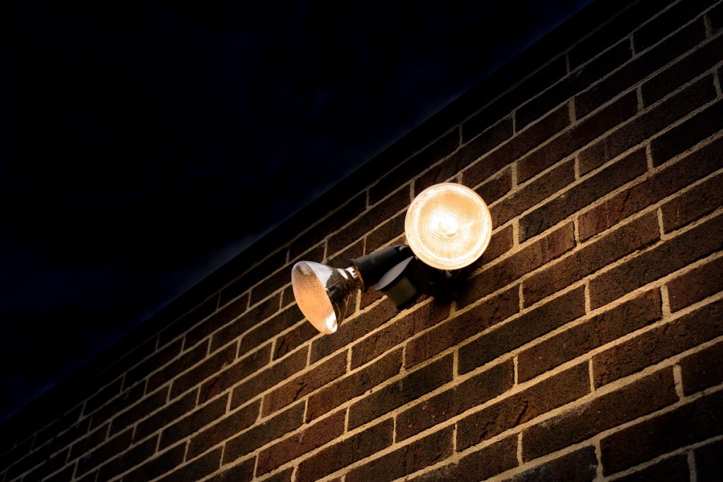 Home motion detector attached on the brick wall