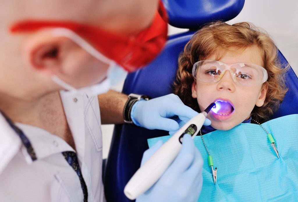 child having his teeth checked