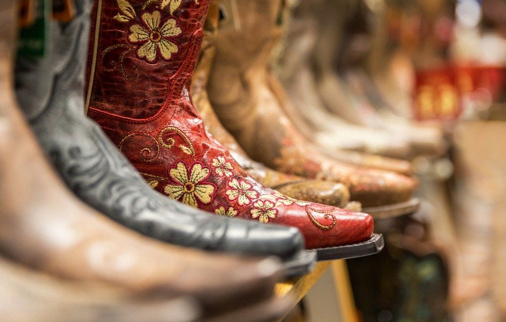 Cowboy boots stored on shelves