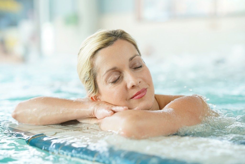 Middle-aged woman enjoying thermal bath