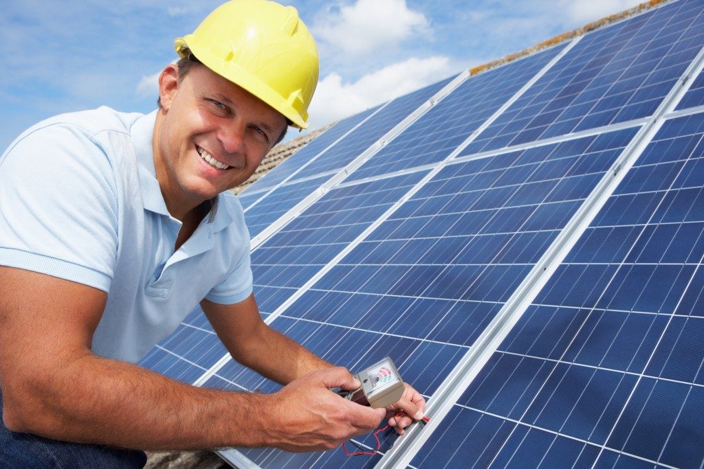 Man building solar panel