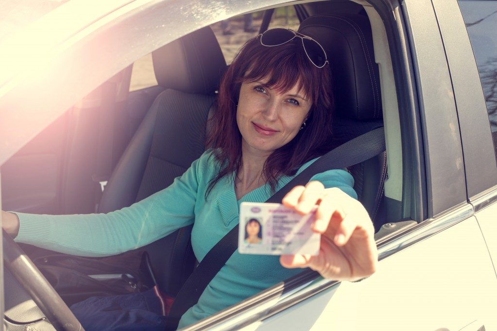 Woman passing her driver's test and getting her driver's license