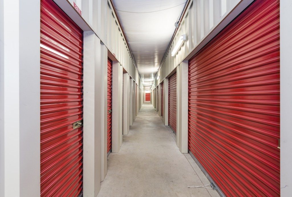 storage unit with red doors in a hallway