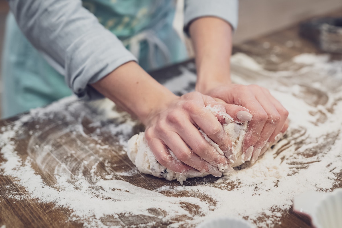 woman kneading the dough