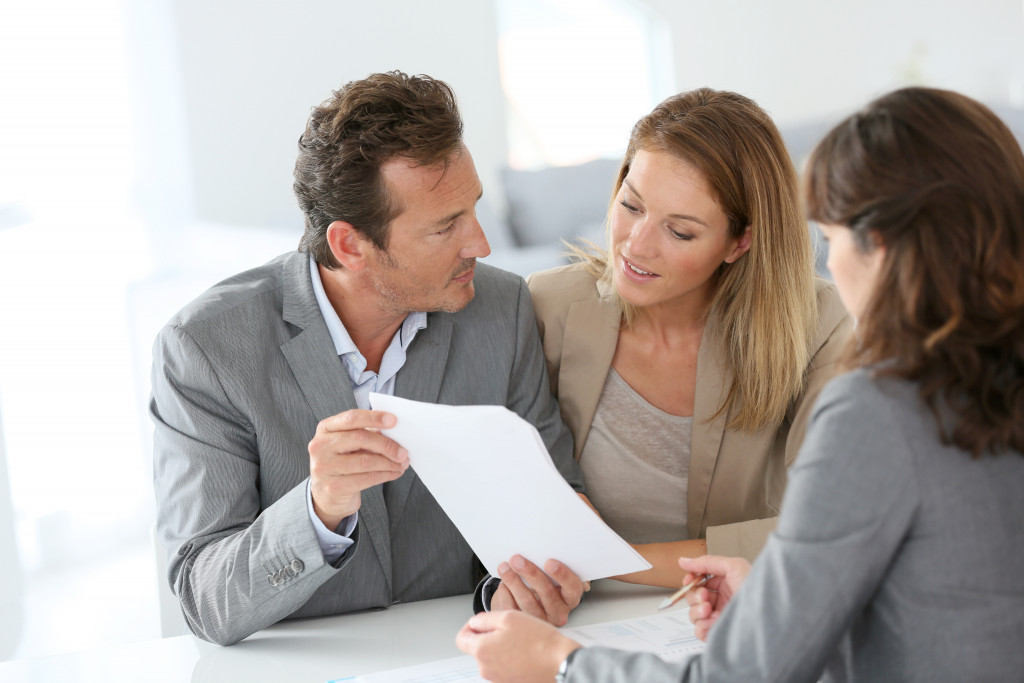 Couple discussing their financial planning with a financial advisor 