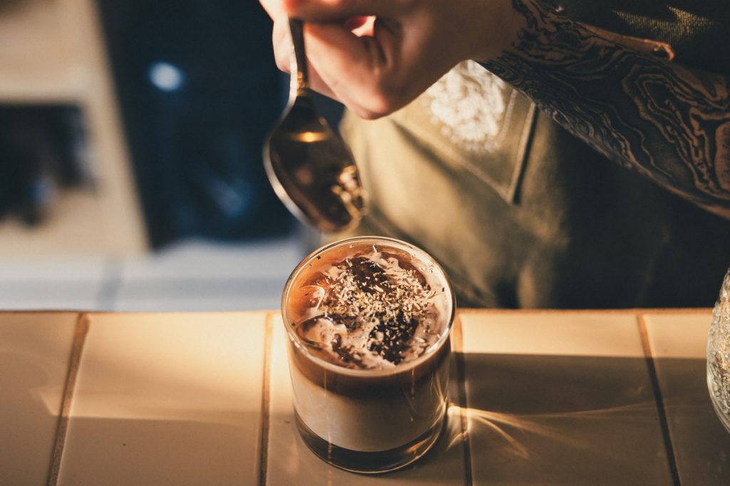 Photo of Barista Holding Stainless Steel Spoon