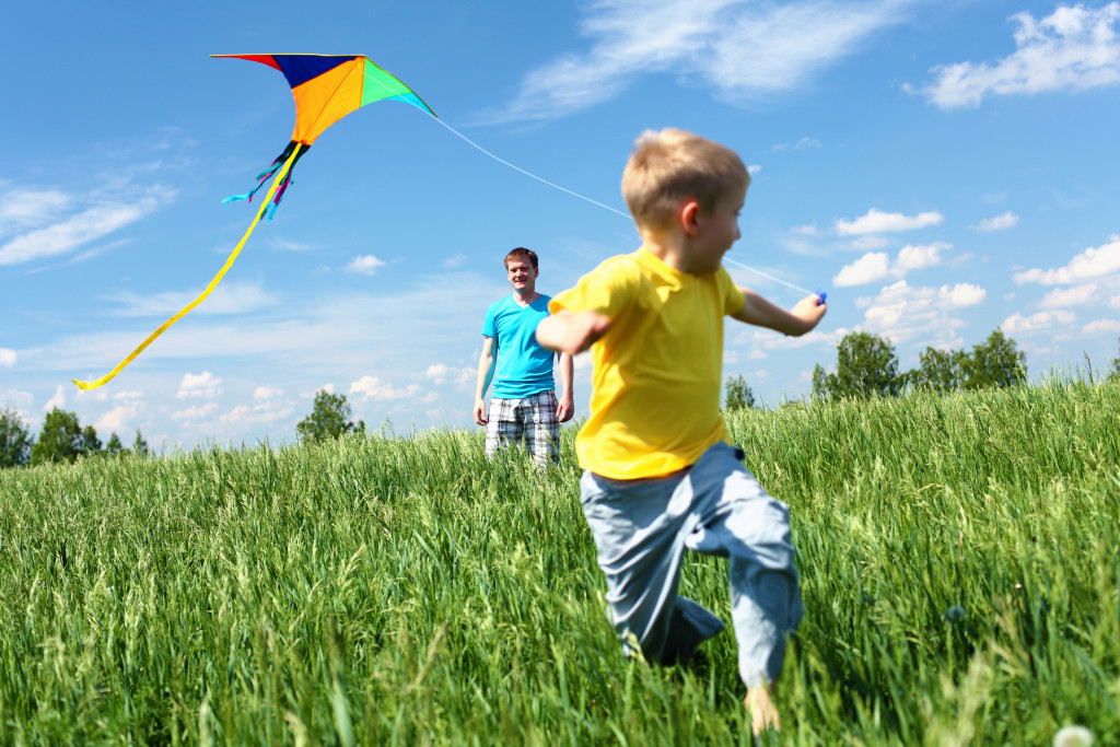 child playing with a kite