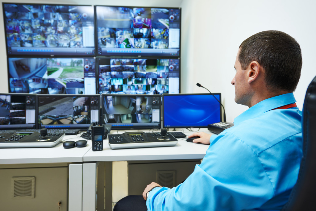 security guard monitoring surveillance in security room