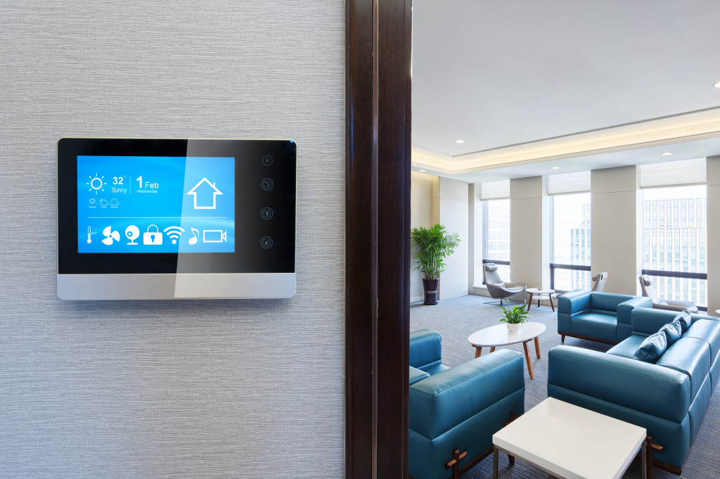 Smart thermostat install on the wall of a home.
