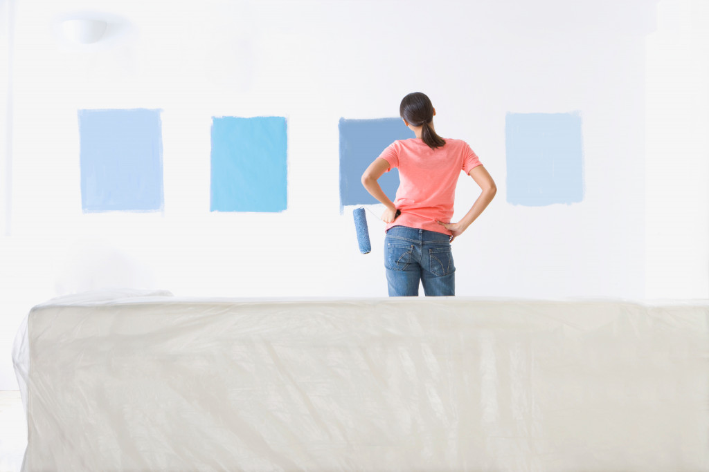 woman choosing a shade of blue for wall