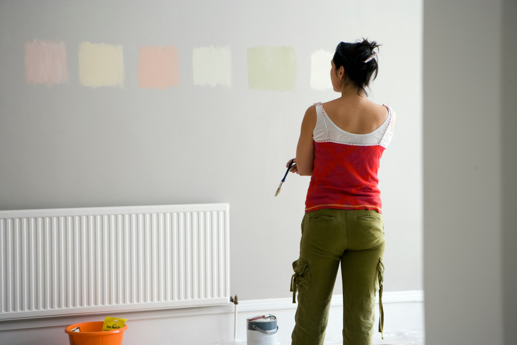 woman choosing a color for her wall