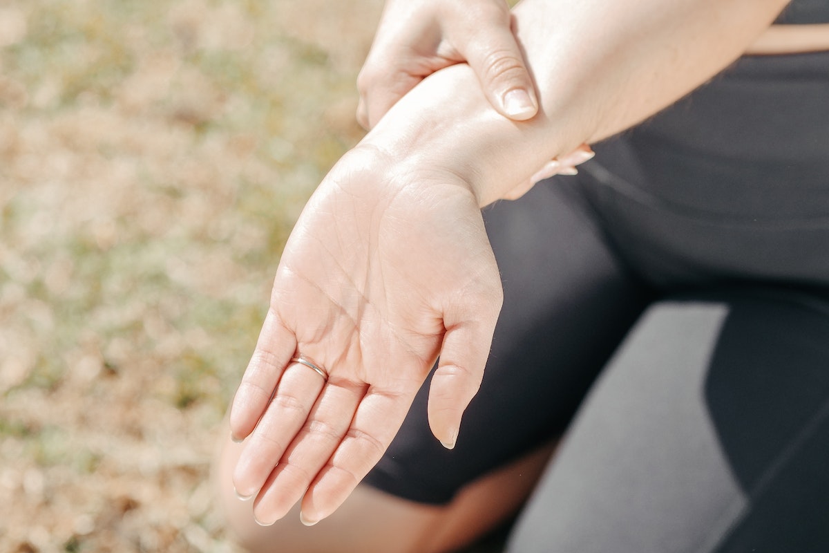 Close-Up Photo of a Woman Stretching Her Wrist