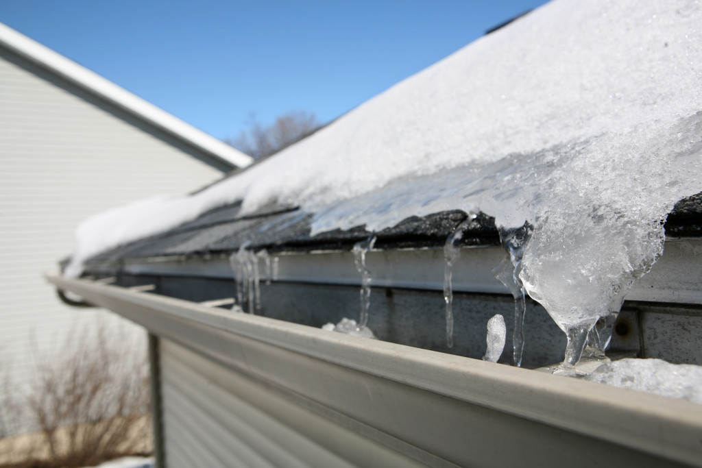 A gutter filled with ice and snow