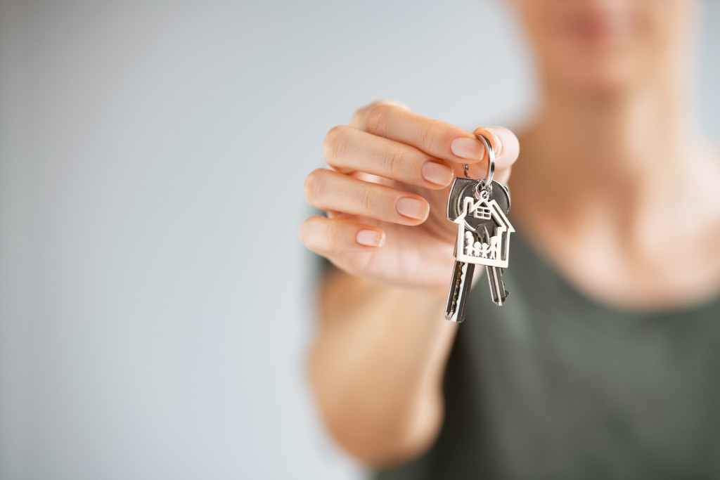 Woman owning a house and her key